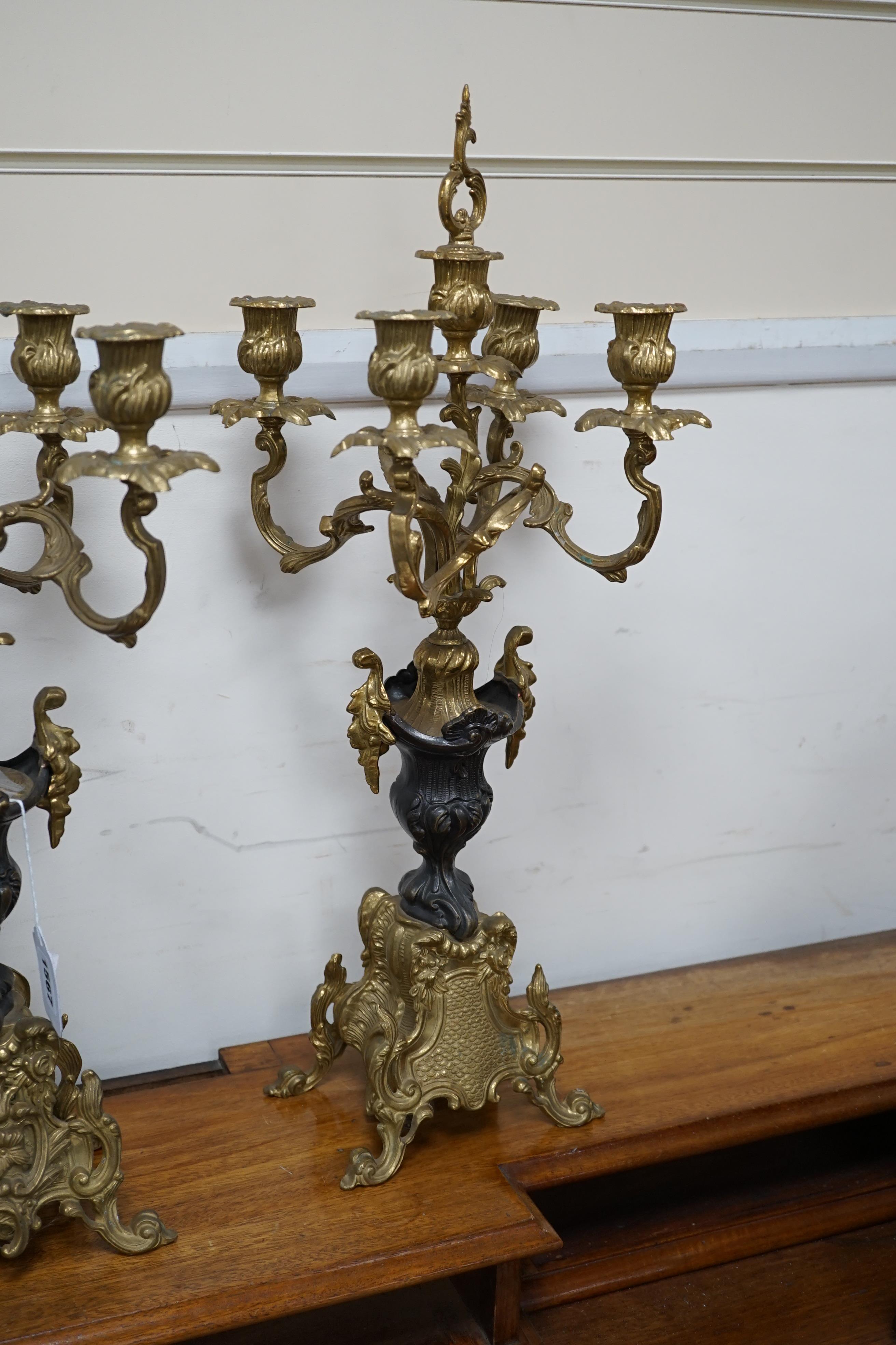 A pair of French brass five light candelabra, 58cm high